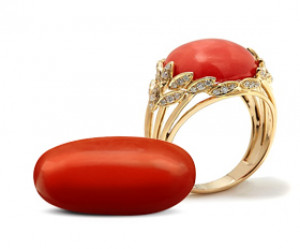 Red coral gemstone ring and loose coral stone in gold setting
