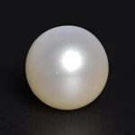 Original white moti gemstone from the best moti shop near me on black background