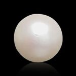 Original white moti gemstone from the best moti shop near me on black background