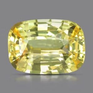 This image displays a faceted, square-shaped yellow sapphire with a bright and translucent appearance. The gemstone exhibits a rich yellow color with natural inclusions, commonly used in fine jewelry and valued for its astrological significance in some cultures.