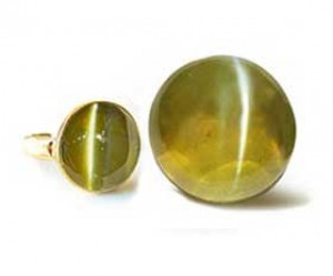 Cat's Eye gemstone ring and loose stone with golden-green hue
